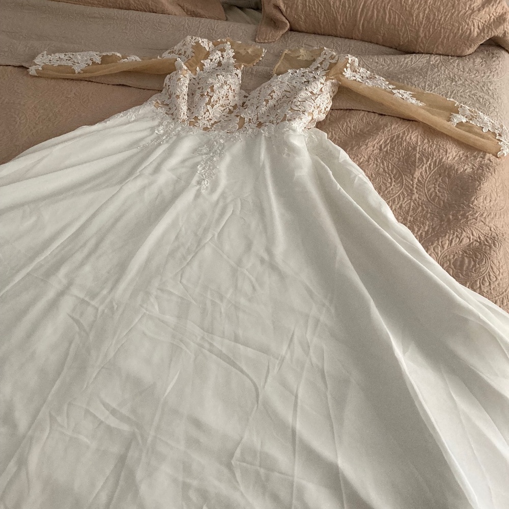 Brand new wedding dress from June bridals .